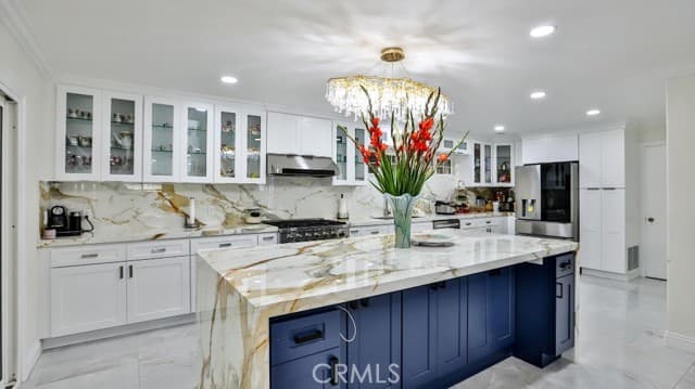 Kitchen at 17230 San Lorenzo Circle featuring a waterfall-style island